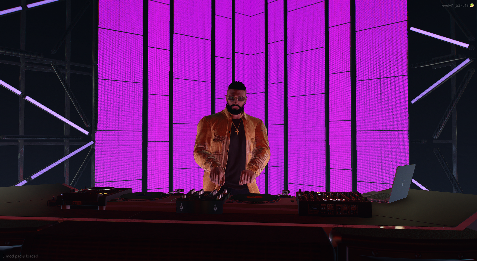 DJ Clip performing on a purple-lit stage